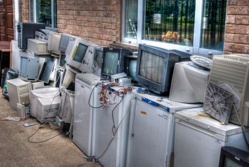 Professionals performing house clearance in a South West London home